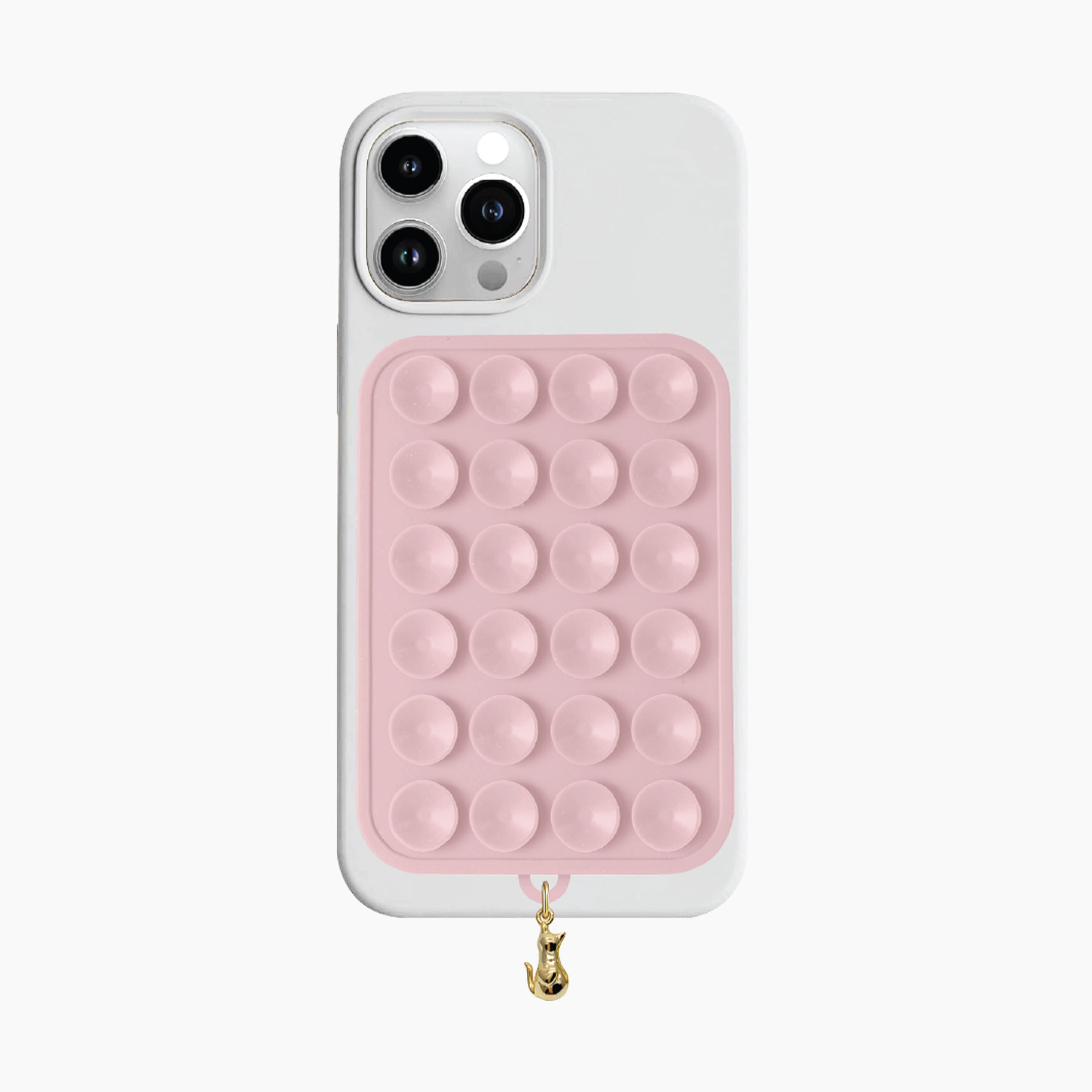 Artikl Snug Magnetic Phone Grip with Cat Charm in Blush Pink, attached to the back of a phone