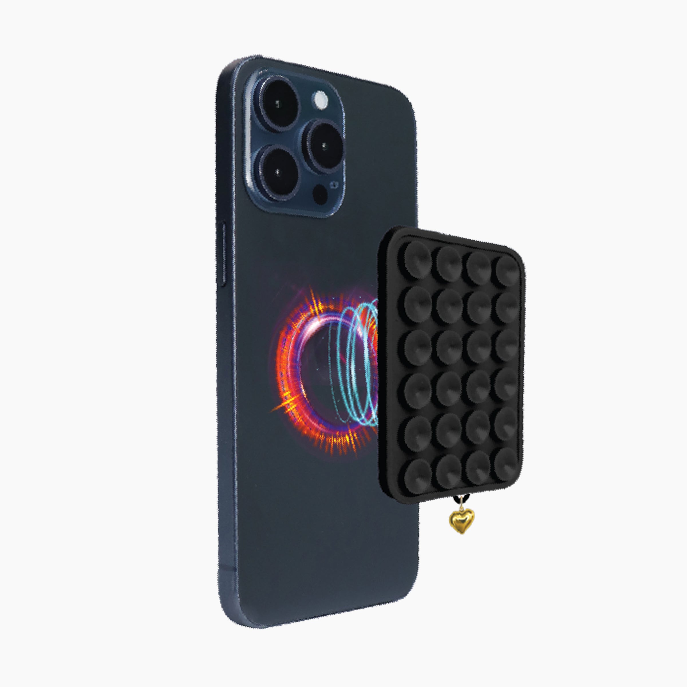 Artikl Snug Magnetic Phone Grip with Gold Heart Charm in Black, detaching from phone demonstrating strong magnetic connection