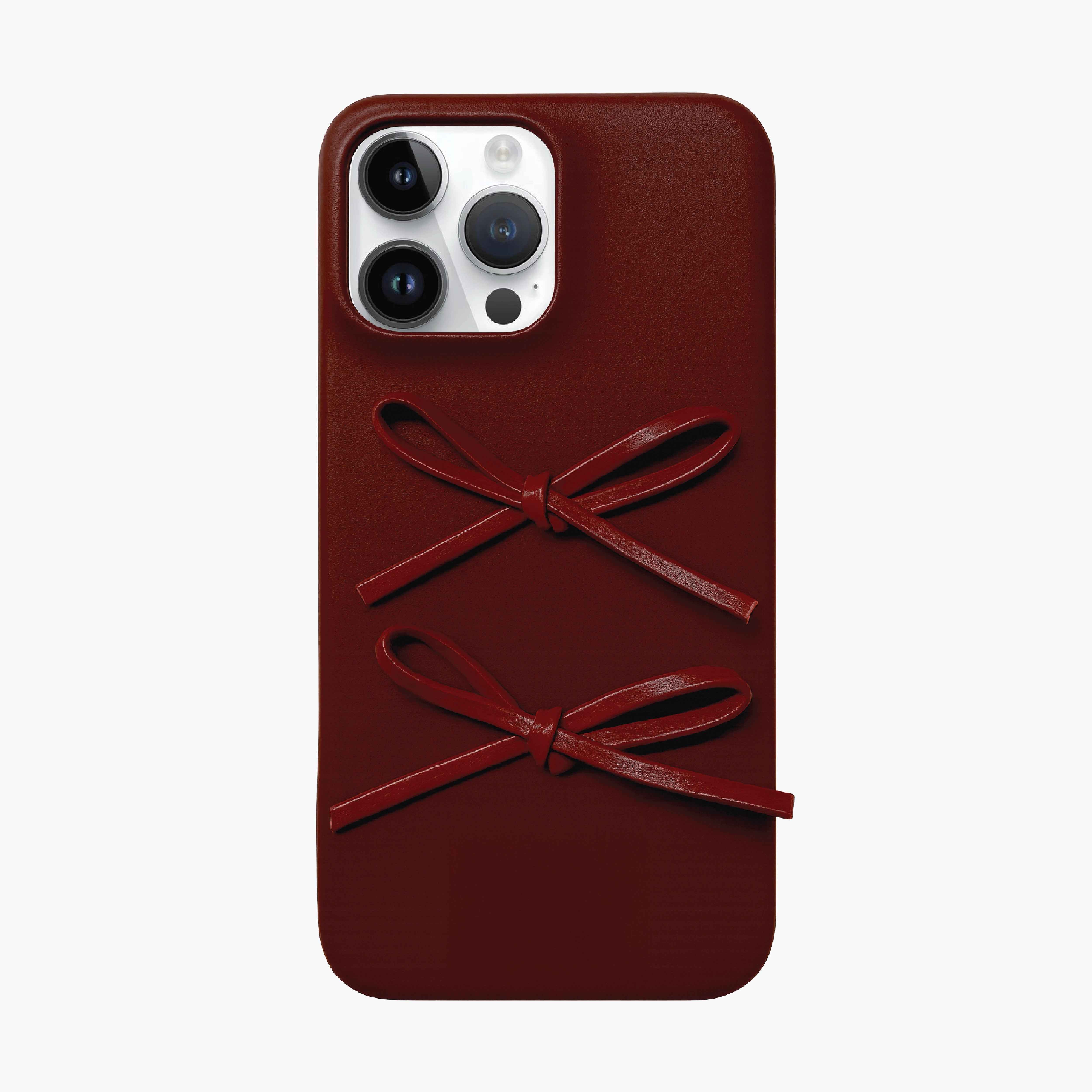 Burgundy Ribbon Bow Phone Case for iPhone 16 Pro Max with decorative bow details, leather-inspired finish, and fashion-forward protective design
