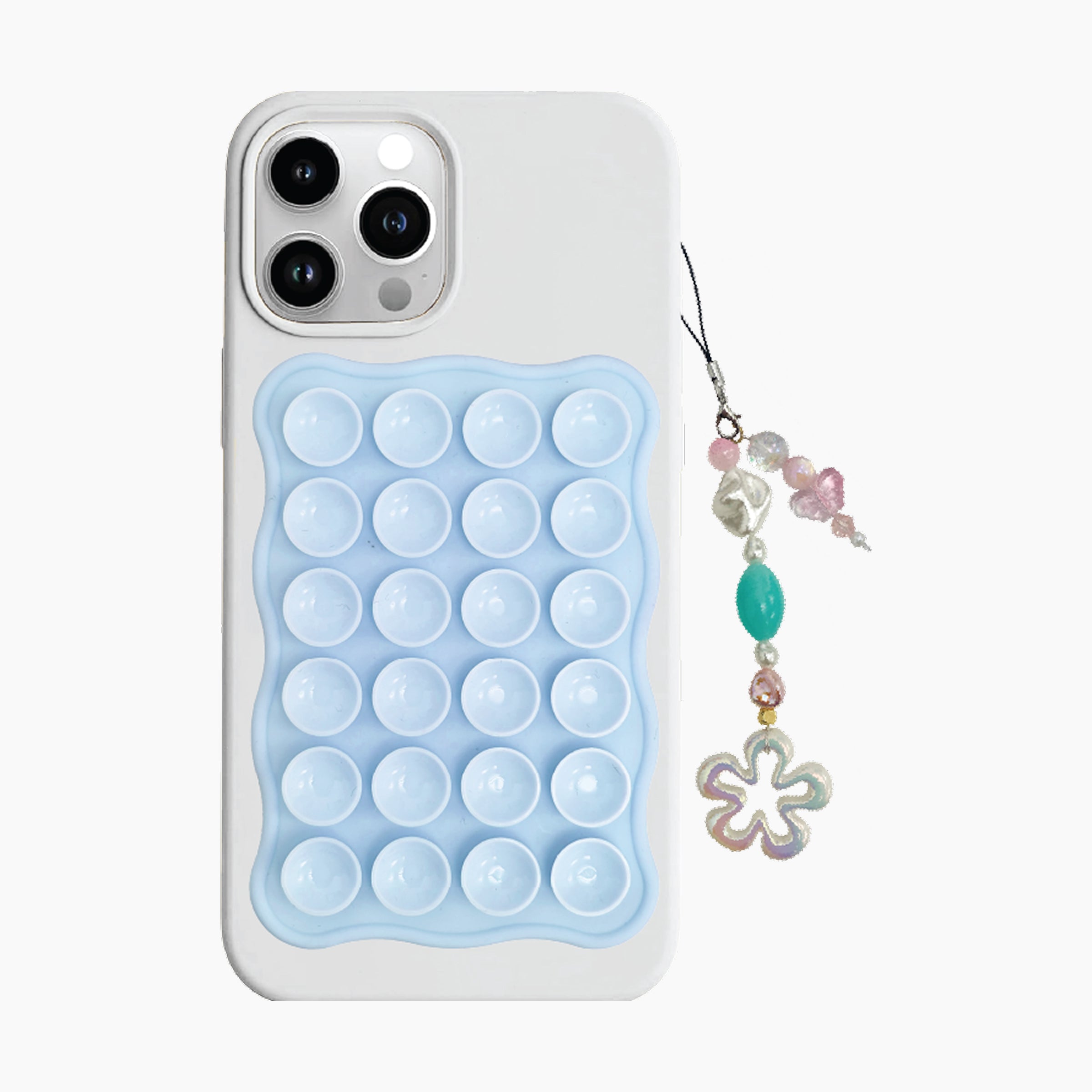 Phone case with bubble design and decorative charm on a white background