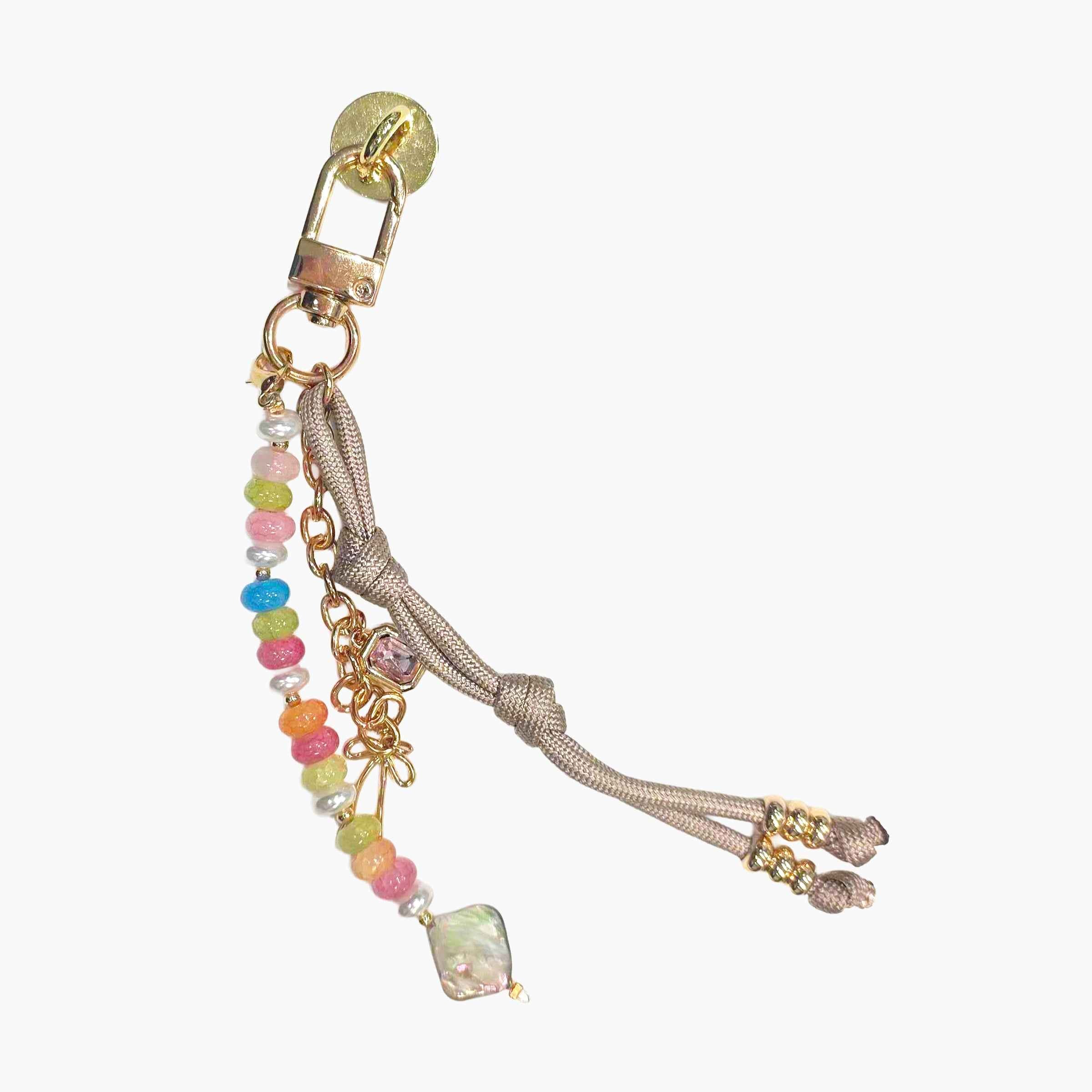 Colorful beaded phone charm with pastel gemstone-style beads, braided cord details, and decorative gold-tone accents