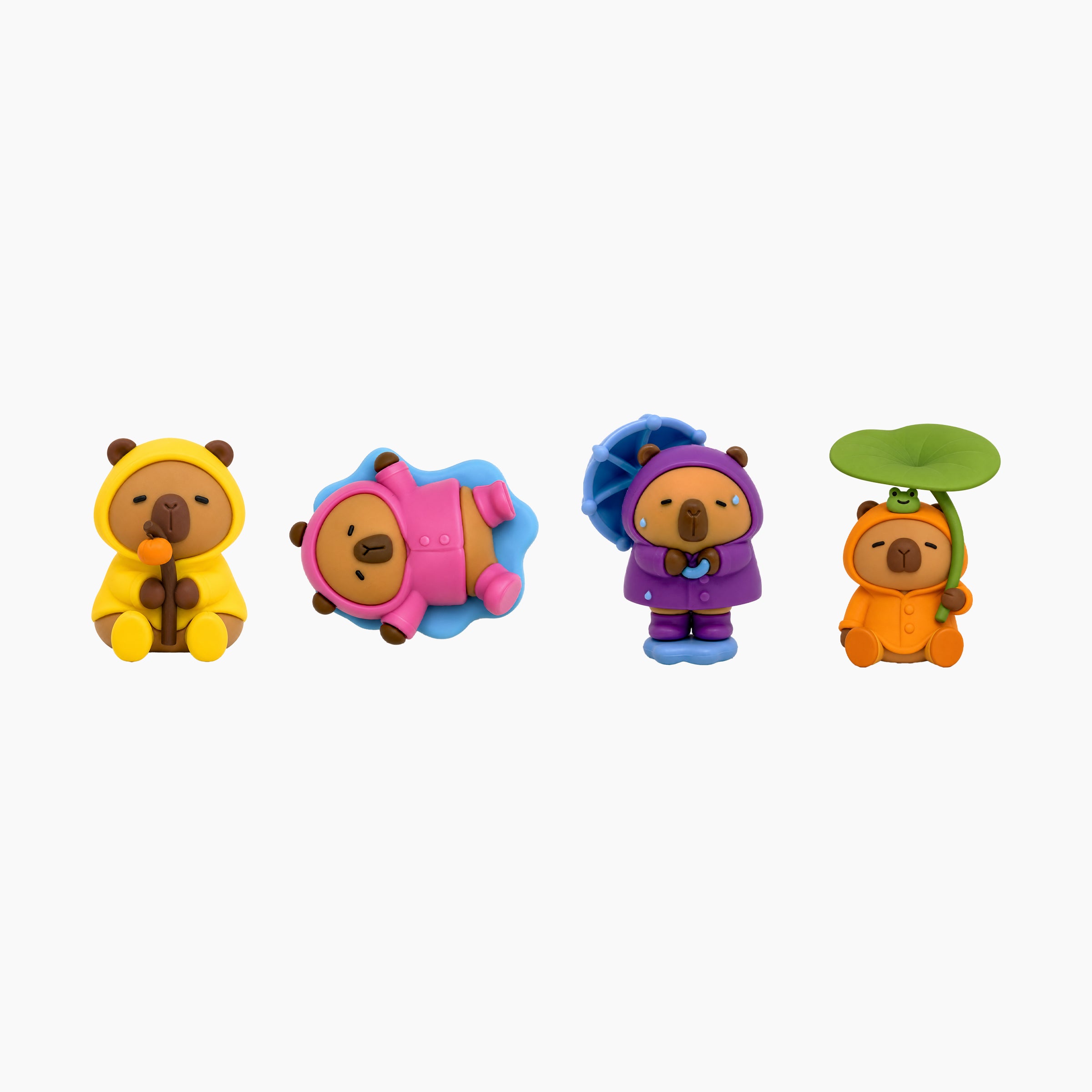 Peek-A-Pals Play in the Rain Capys collectible figure series featuring capybara companions in raincoats, umbrellas, and playful rainy day accessories
