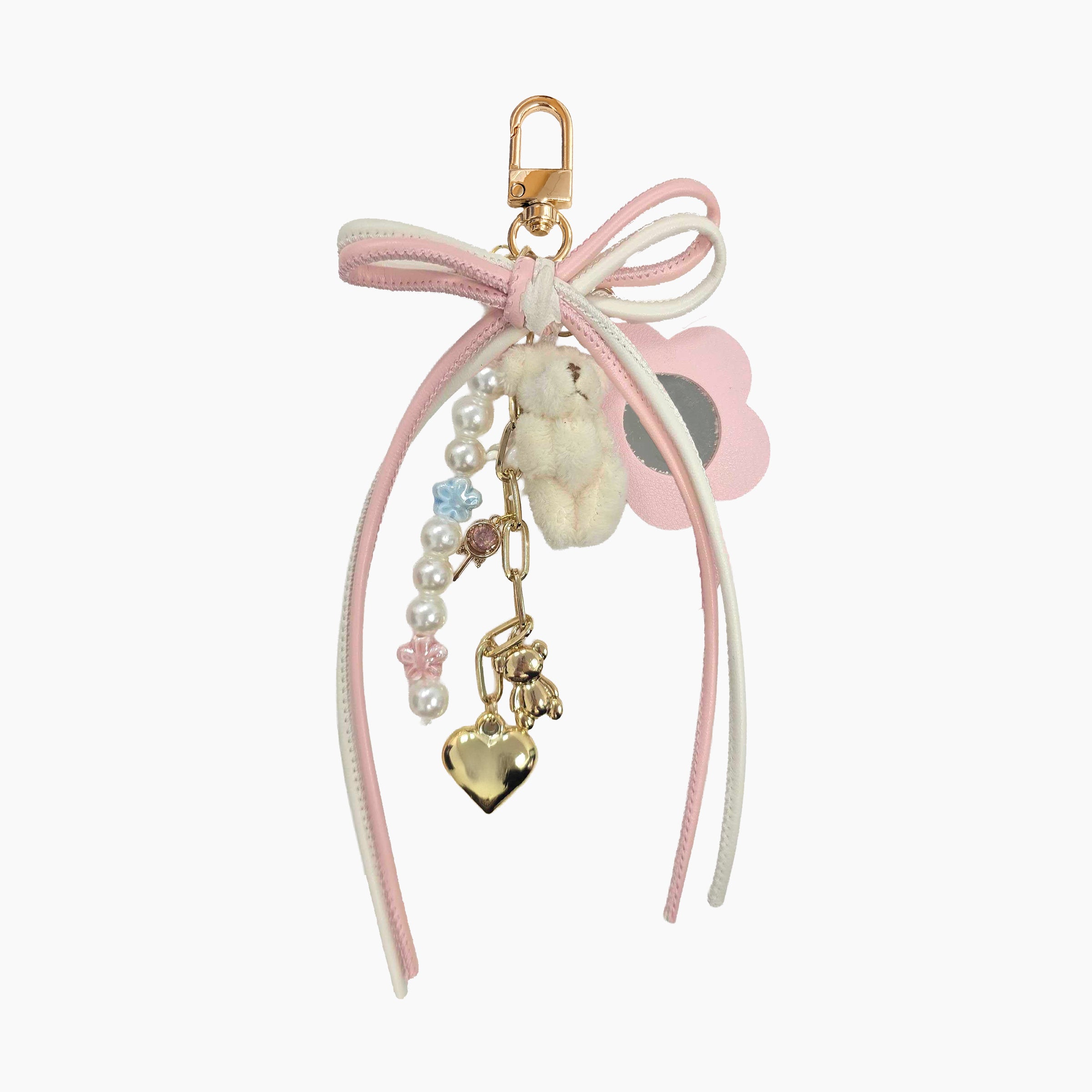 Cute pink and white bow phone charm featuring a plush teddy bear, pearl bead chain, gold heart pendant, and flower accent. Coquette-style kawaii phone strap accessory with pastel aesthetic, perfect for decorating phones, bags, keychains, and handbags.