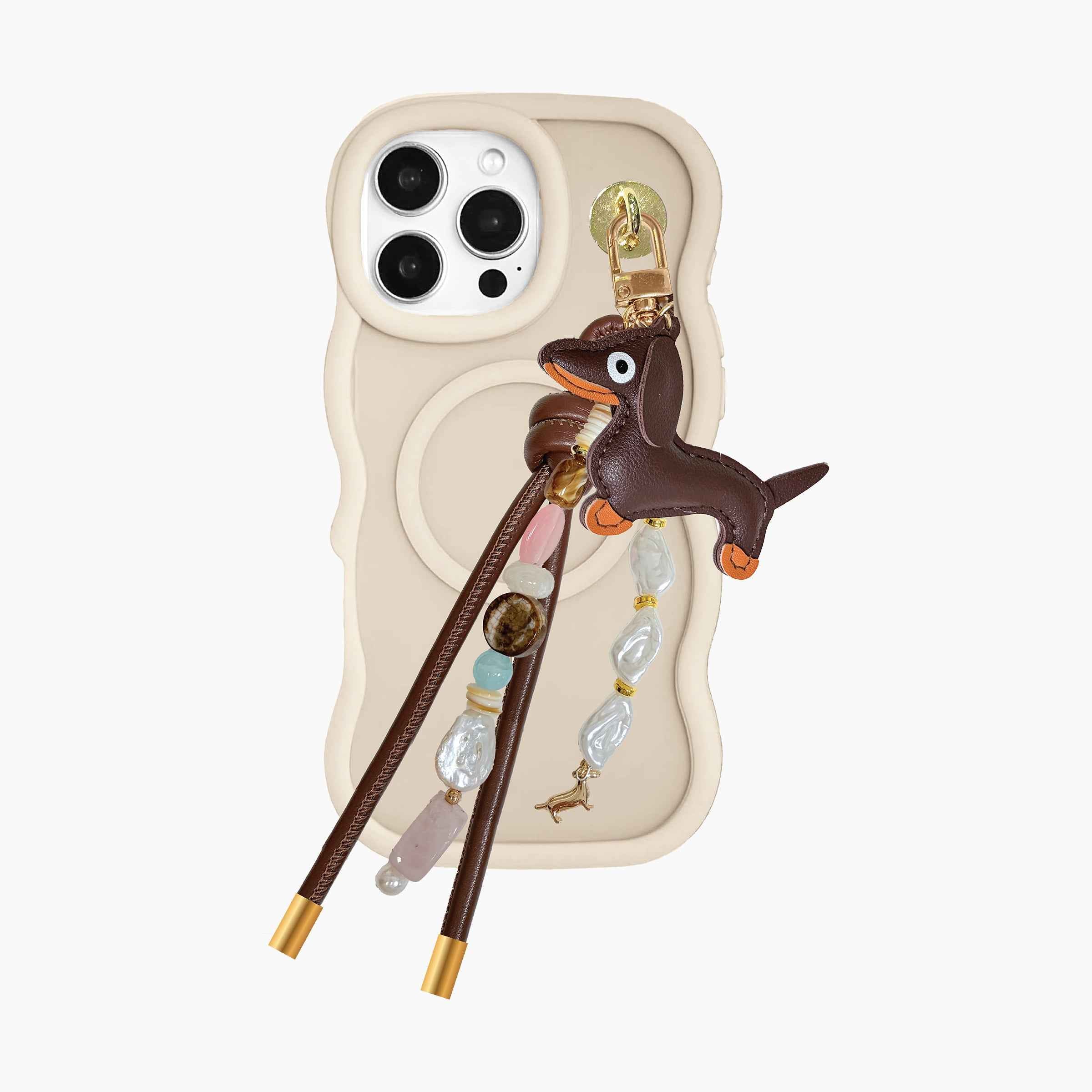 Dachshund-inspired phone charm attached to MagSafe phone case featuring leather dog pendant, gemstone-style beads, pearl accents, and decorative tassel details
